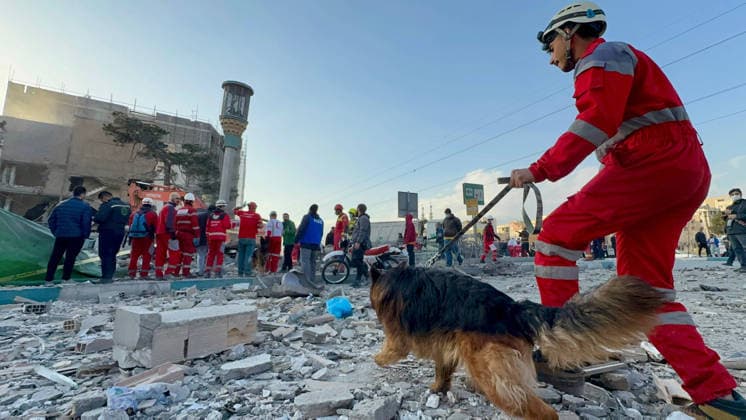Members of Iranian rescue teams search through the rubble for victims inside a building targeted by Israeli-American airstrikes in Tehran, Iran, on Monday, March 2, 2026. Photo: Iranian Red Crescent  IRN2026030225 IranianxRedxCrescent