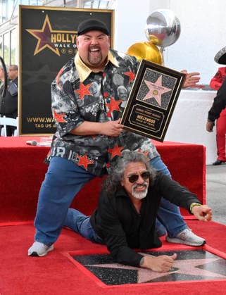 Comedian Gabriel Fluffy Iglesias holds a replica plaque as he is joined by Martin Moreno during unveiling ceremony honoring him with the 2,838th star on the Hollywood Walk of Fame in Los Angeles on Tuesday, March 3, 2026.  LAP2026030306 JIMxRUYMEN