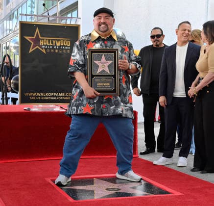 Comedian Gabriel Fluffy Iglesias holds up a replica plaque as he stands on his star during unveiling ceremony honoring him with the 2,838th star on the Hollywood Walk of Fame in Los Angeles on Tuesday, March 3, 2026.  LAP2026030307 JIMxRUYMEN