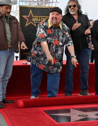 Comedian Gabriel Fluffy Iglesias points to his star during an unveiling ceremony honoring him with the 2,838th star on the Hollywood Walk of Fame in Los Angeles on Tuesday, March 3, 2026.  LAP2026030314 JIMxRUYMEN