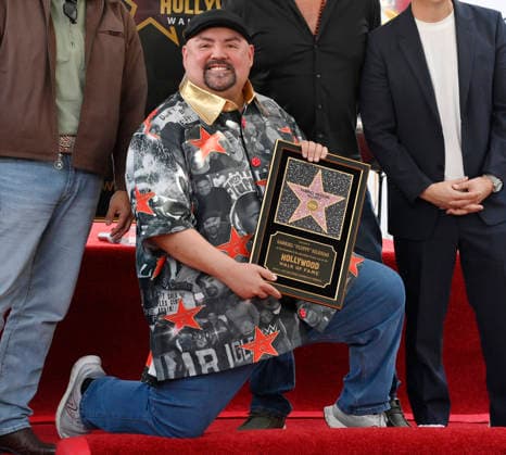 Comedian Gabriel Fluffy Iglesias holds a replica plaque during an unveiling ceremony honoring him with the 2,838th star on the Hollywood Walk of Fame in Los Angeles on Tuesday, March 3, 2026.  LAP2026030316 JIMxRUYMEN