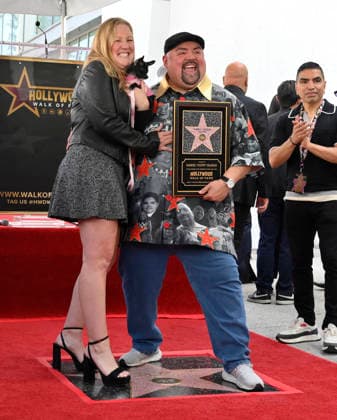 Comedian Gabriel Fluffy Iglesias holds a replica plaque as he is joined by his partner Tiffany Kate during unveiling ceremony honoring him with the 2,838th star on the Hollywood Walk of Fame in Los Angeles on Tuesday, March 3, 2026.  LAP2026030321 JIMxRUYMEN