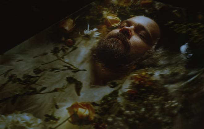 Bearded man floating in a water with plants and flowers Los Angeles, California, United States CR_ARZH250617-1768095-01 ,model released, Symbolfoto