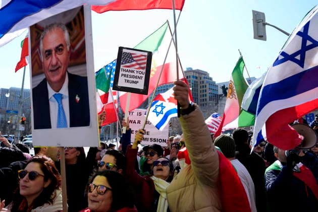 March 4, 2026, Ottawa, On, CAN: A person holds up a sign thanking U.S. President Donald Trump as they rally in support of the United States and Israel s military strikes in Iran, outside the Ottawa Conference on Defence and Security in Ottawa, on Wednesday, March 4, 2026. Ottawa CAN  - ZUMAc35_ 20260304_zaf_c35_086 Copyright: xJustinxTangx