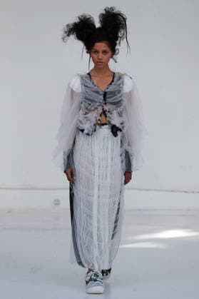 PFW - Reverie by Caroline Hu Runway A model walks the runway during the Reverie by Caroline Hu Womenswear Fall Winter 2026-2027 show as part of Paris Fashion Week on March 04, 2026 in Paris, France. Photo by Alain Gil Gonzalez ABACAPRESS.COM Paris France  Copyright: xGonzalezxAlain-Gil ABACAx