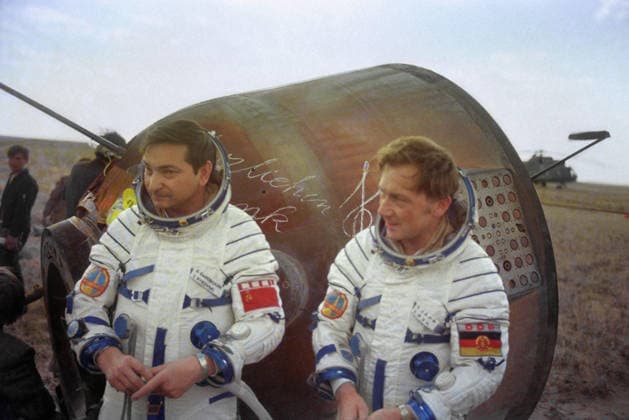 Dzhezkazgan region, Kazakh SSR, USSR. Members of the international crew of the Soyuz-29 manned spacecraft commander twice Hero of the Soviet Union, Soviet cosmonaut Valery Bykovsky (L) and cosmonaut-researcher from the German Democratic Republic Sigmund Jaehn stand near the landing capsule. Albert Pushkarev, Alexander Sentsov TASS  548681