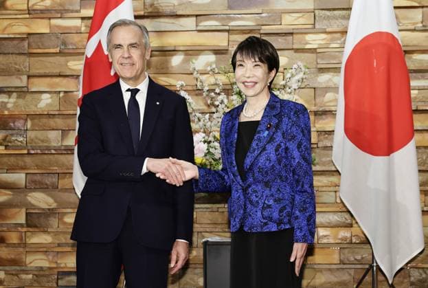 Japan-Canada talks Japanese Prime Minister Sanae Takaichi (R) and her Canadian counterpart Mark Carney shake hands ahead of their talks at her office in Tokyo on March 6, 2026.  A14AA0005354572P