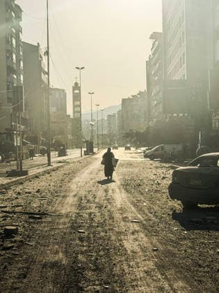 (260306) -- BEIRUT, March 6, 2026 -- A pedestrian walks on a street full of debris after an Israeli airstrike in Beirut s southern suburbs, Lebanon, March 6, 2026. Dozens of Israeli airstrikes targeted areas across Lebanon overnight and early Friday, striking Beirut s southern suburbs, southern Lebanon and the Bekaa Valley amid escalating military tensions. (Photo by Xinhua) LEBANON-BEIRUT-ISRAELI AIRSTRIKE BilalxJawich 
