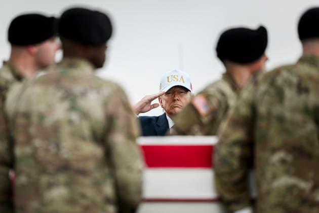 March 8, 2026, Dover, De, United States of America: U.S. President Donald Trump, salutes as the remains of six soldiers killed by a Iranian Drone arrive at Dover Air Force Base, March 7, 2026, in Dover, Delaware. Dover United States of America - ZUMAp138 20260308_zaa_p138_003 Copyright: xDanielxTorok WhitexHousex