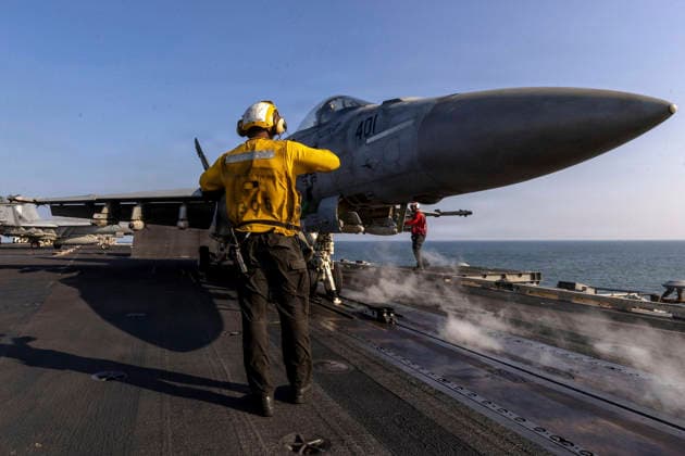 March 8, 2026, Undisclosed Location, United States: A U.S. Navy air boss signals a F A-18E Super Hornet, with the Vigilantes of Strike Fighter Squadron 151, to prepare to launch off the flight deck of the Nimitz-class aircraft carrier USS Abraham Lincoln during Operation Epic Fury, March 6, 2026, from an undisclosed location. The United States and Israel launched joint strikes on Iran. Undisclosed Location United States - ZUMAp138 20260308_zaa_p138_027 Copyright: xUsxNavy U.S.xNavyx