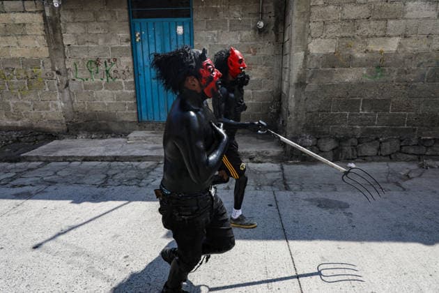 Traditional Xinacates Festival in San Nicolas de Los Ranchos Inhabitants of San Nicolas de los Ranchos whit their bodies panted walking on the streets during the traditional Xinacates festival, also known as the Festival of the Painted, where they perform dances as an offering for the start of the crops and to obtain a good harvest in the municipality of San Nicolas de los Ranchos located on the slopes of the Popocatepetl volcano. on March 8, 2026 in San Nicolas de Los Ranchos, Mexico. (Photo by Ian Robles Eyepix Group) Copyright: xIanxRobles xEyepixxGroupx EL_08032026_177758JPEG