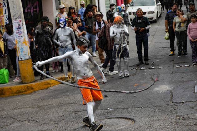 Traditional Xinacates Festival in San Nicolas de Los Ranchos A young whit his body painted lashes out with a rope during the traditional Xinacates festival, also known as the Festival of the Painted, where they perform dances as an offering for the start of the crops and to obtain a good harvest in the municipality of San Nicolas de los Ranchos located on the slopes of the Popocatepetl volcano. on March 8, 2026 in San Nicolas de Los Ranchos, Mexico. (Photo by Ian Robles Eyepix Group) Copyright: xIanxRobles xEyepixxGroupx EL_08032026_177782JPEG