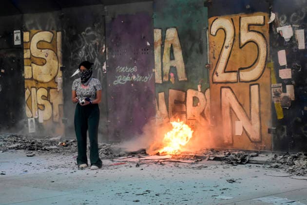 Protest For International Women s Day A woman burns placards in a rally for International Women s Day at main square Zocalo. on March 8, 2026 in Mexico City, Mexico. (Photo by Luis Barron Eyepix Group) Copyright: xLuisxBarronx xEyepixxGroupx LB_08032026_177795