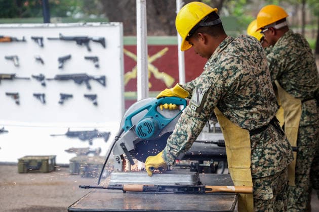 Mexican Army destroys seized weapons in Sinaloa SINALOA, MEXICO - MARCH 09: The Mexican Army destroy 610 long guns and 92 handguns, as well as 5,013 magazines and 316,036 rounds of ammunition during an official ceremony at the 9th Military Zone in Sinaloa, Mexico, on March 09, 2026. These weapons were seized from organized crime during recent federal operations in Sinaloa. Among the destroyed weapons were Colt 1911 pistols with gold embellishments that may have belonged to drug traffickers. Weapons seizures have increased in recent months due to the greater military presence in Sinaloa amid the ongoing conflict between internal factions of the Sinaloa Cartel. Jesus Verdugo Anadolu Sinaloa Mexico. Editorial use only. Please get in touch fo  Copyright: x2026xAnadoluxJesusxVerdugox