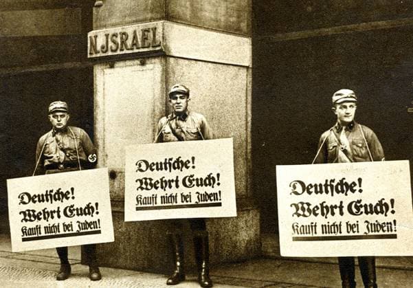 RECORD DATE NOT STATED Anti-semitism in Germany, 1933. Nazi pickets outside a Jewish-owned store carrying placards which read Germans! Take Care! Do not buy from Jews! . Copyright: xWorldxHistoryxArchivex