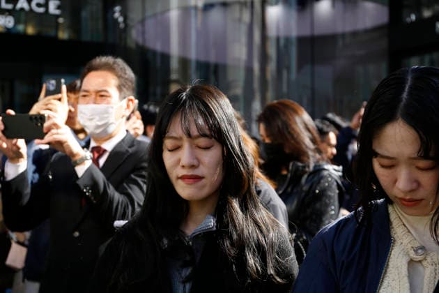 March 11, 2026, Tokyo, Japan: People pray during a moment of silence at 2:46 pm for the victims of the Great East Japan Earthquake-Tsunami and nuclear disaster outside the WAKO department store in Ginza. This year marked 15 years since an earthquake and tsunami disaster that killed thousands and led to the Fukushima nuclear crisis. Tokyo Japan - ZUMAm191 20260311_aap_m191_003 Copyright: xRodrigoxReyesxMarinx