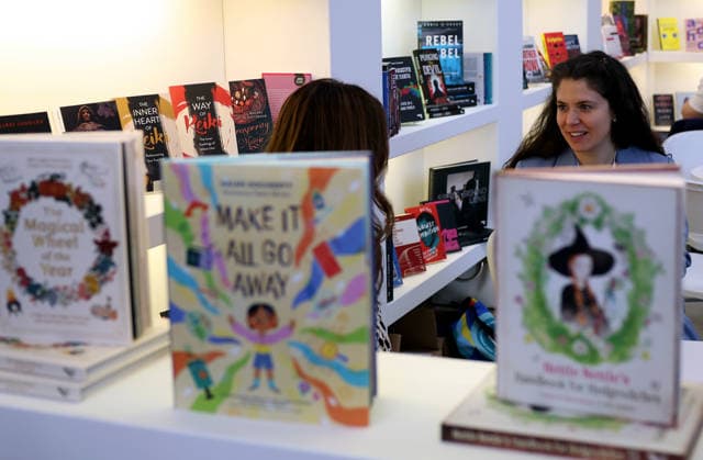 (260311) -- LONDON, March 11, 2026 -- People talk at the 2026 London Book Fair in London, Britain, March 10, 2026. The 2026 London Book Fair kicked off here on Tuesday. ) BRITAIN-LONDON-BOOK FAIR-OPENING LixYing 