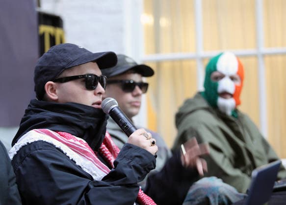Kneecap s member hold a press conference in Belfast BELFAST, NORTHERN IRELAND - MARCH 11: Kneecap s Mo Chara, Muhllai Bap, DJ Provai hold a press conference at Conway Mill in Belfast, Northern Ireland on March 11, 2026. The UK government lost its appeal over a judge s decision to dismiss terror charges against Liam Og O hAnnaidh, known as Mo Chara related to allegedly displaying a Hezbollah flag at a concert in London in November 2024. The High Court delivered its judgment in an appeal brought by the Director of Public Prosecutions (DPP) challenging the magistrates’ court ruling that dismissed the case against the band member. Conor Mccaughley Anadolu Belfast Ireland. Editorial use only. Please get in touch for any other usage.  Copyright: x2026xAnadoluxConorxMccaughleyx