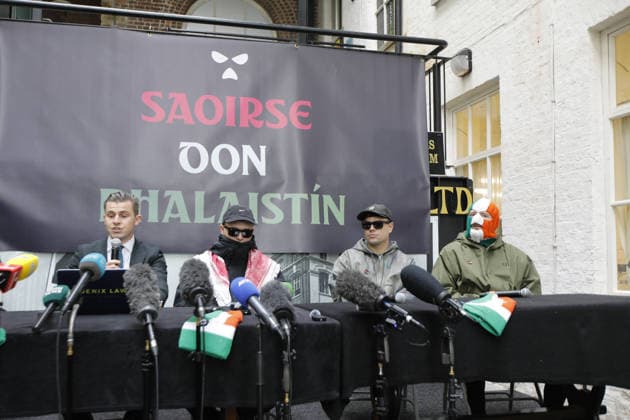 Kneecap s member hold a press conference in Belfast BELFAST, NORTHERN IRELAND - MARCH 11: Kneecap s Mo Chara, Muhllai Bap, DJ Provai hold a press conference at Conway Mill in Belfast, Northern Ireland on March 11, 2026. The UK government lost its appeal over a judge s decision to dismiss terror charges against Liam Og O hAnnaidh, known as Mo Chara related to allegedly displaying a Hezbollah flag at a concert in London in November 2024. The High Court delivered its judgment in an appeal brought by the Director of Public Prosecutions (DPP) challenging the magistrates’ court ruling that dismissed the case against the band member. Conor Mccaughley Anadolu Belfast Ireland. Editorial use only. Please get in touch for any other usage.  Copyright: x2026xAnadoluxConorxMccaughleyx