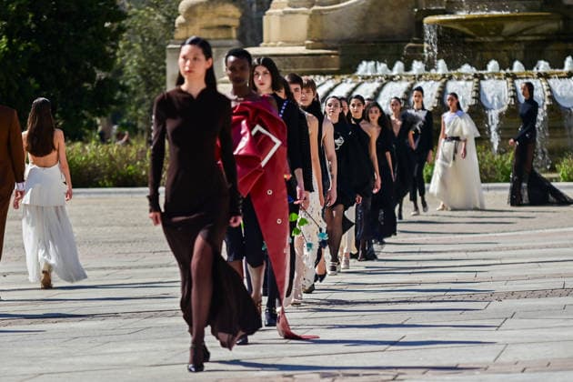 March 12, 2026, Madrid, Madrid, SPAIN: Models walk the runway on the urban catwalk set up in Plaza de EspaoÂ±a during the opening event of OMODA Madrid es Moda, marking the start of Madrid Fashion Week. The show brings together 25 Spanish independent fashion designers in one of the capital s most iconic locations. Madrid SPAIN - ZUMAz108 20260312_znp_z108_025 Copyright: xRichardxZubelzux