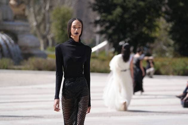 March 12, 2026, Madrid, Madrid, SPAIN: Models walk the runway on the urban catwalk set up in Plaza de Espana during the opening event of OMODA Madrid es Moda, marking the start of Madrid Fashion Week. The show brings together 25 Spanish independent fashion designers in one of the capital s most iconic locations Cordon Press 