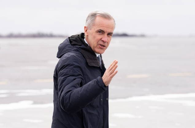 March 12, 2026, Ottawa, Canada: Prime Minister Mark Carney waves as he makes his way to a government plane at the airport in Ottawa, Thursday, March 12, 2026. Ottawa Canada  - ZUMAc35_ 20260312_zaf_c35_022 Copyright: xAdrianxWyldx