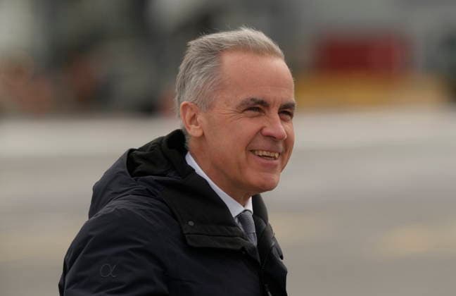 March 12, 2026, Ottawa, On, Canada: Prime Minister Mark Carney boards a government plane in Ottawa, Thursday, March 12, 2026. Ottawa Canada  - ZUMAc35_ 20260312_zaf_c35_025 Copyright: xAdrianxWyldx