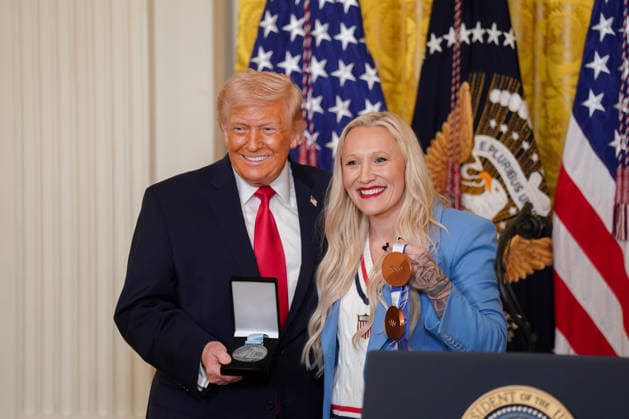 Kaillie Humphries, US Olympic bronze medalist bobsled athlete, presents the Order of Ikkos to President Donald Trump during a Women s History Month event in the East Room of the White House in Washington, DC, US, on Thursday, March 12, 2026. Every year, March is designated Women s History Month by presidential proclamation.  WASP2026031206 ALxDRAGO