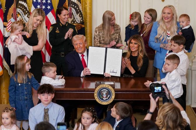 First Lady Melania Trump, right, applauds as President Donald Trump displays a signed proclamation during a Women s History Month event in the East Room of the White House in Washington, DC, US, on Thursday, March 12, 2026. Every year, March is designated Women s History Month by presidential proclamation.  WASP2026031208 ALxDRAGO