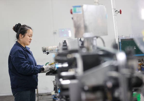 Lithium-ion Batteries Manufacturing in Sanmenxia SANMENXIA, CHINA - MARCH 12, 2026 - A worker in the production workshop of Henan Pude New Energy Technology Co., Ltd. is engaged in the production of lithium-ion batteries in Sanmenxia City, Henan Province, China on March 12, 2026. Sanmenxia Henan China  Copyright: xCFOTOx i1773416479476