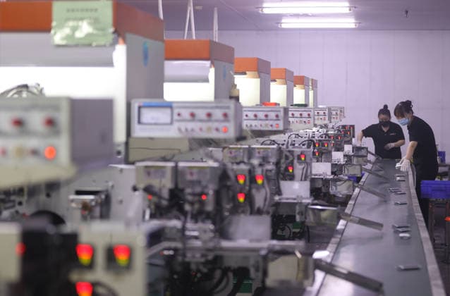 Lithium-ion Batteries Manufacturing in Sanmenxia SANMENXIA, CHINA - MARCH 12, 2026 - A worker in the production workshop of Henan Pude New Energy Technology Co., Ltd. is engaged in the production of lithium-ion batteries in Sanmenxia City, Henan Province, China on March 12, 2026. Sanmenxia Henan China  Copyright: xCFOTOx i1773416479675