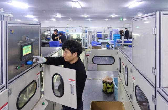 Lithium-ion Batteries Manufacturing in Sanmenxia SANMENXIA, CHINA - MARCH 12, 2026 - A worker in the production workshop of Henan Pude New Energy Technology Co., Ltd. is engaged in the production of lithium-ion batteries in Sanmenxia City, Henan Province, China on March 12, 2026. Sanmenxia Henan China  Copyright: xCFOTOx i1773416479843