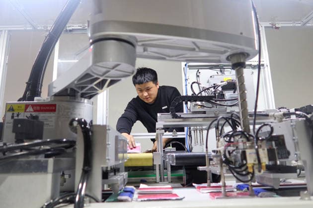 Lithium-ion Batteries Manufacturing in Sanmenxia SANMENXIA, CHINA - MARCH 12, 2026 - A worker in the production workshop of Henan Pude New Energy Technology Co., Ltd. is engaged in the production of lithium-ion batteries in Sanmenxia City, Henan Province, China on March 12, 2026. Sanmenxia Henan China  Copyright: xCFOTOx i1773416480242