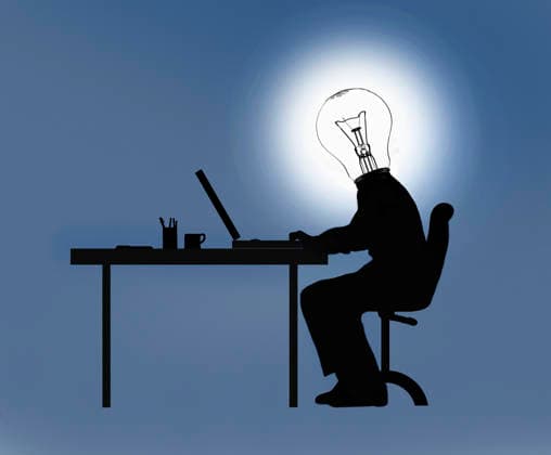 Geschäftsmann arbeitet am Schreibtisch mit Glühbirnen-Kopf *** Businessman works at desk with light bulbs head  Copyright: xGaryxWatersx 11591574 RECORD DATE NOT STATED