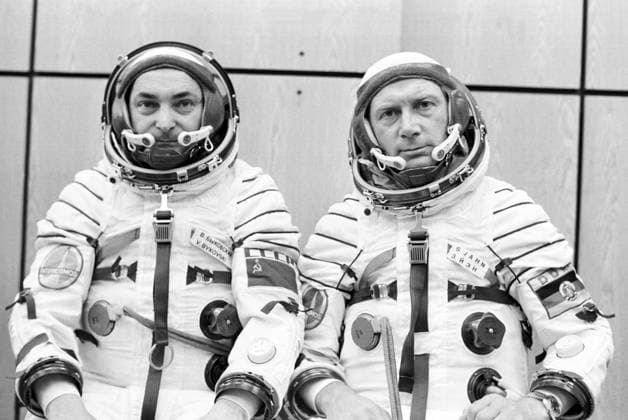 August, 1978. Baikonur, Kyzylorda Region, Kazakh SSR, USSR. Members of the international crew of the Soyuz 31 commander, twice Hero of the Soviet Union, Soviet cosmonaut Valery Bykovsky (L) and cosmonaut-researcher from the German Democratic Republic, Lieutenant Colonel Sigmund Jaehn take part in a pre-flight preparations at the Baikonur Cosmodrome. The exact date of the photograph is unknown. Albert Pushkarev, Alexander Sentsov TASS  4485847