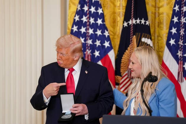 Trump Hosts Women s History Month Event Kaillie Humphries, United States Olympic bronze medalist bobsled athlete, presents the Order of Ikkos to US President Donald J Trump during a Women s History Month event in the East Room of the White House in Washington, DC, USA, on Thursday, March 12, 2026. Every year, March is designated Women s History Month by presidential proclamation. Credit: CNP AdMedia Washington District of Columbia United States of America EDITORIAL USE ONLY  Copyright: xx FTP_AD_03980_1-6137912 CNPx xAdMediax admphotostwo974276