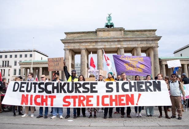 March 14, 2026, Berlin, Berlin, Germany: Head of the rally during a demonstration in Berlin, Germany, opposing the halt of admissions to integration and language courses. The Banner reads Safe German courses, donÃ‚Â t stop them The protesters are in front of the Brandenburg Gate. Berlin Germany  - ZUMAc291 20260314_zip_c291_006 Copyright: xMariaxCastrox