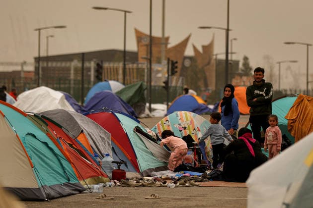 March 14, 2026, Beirut, Beirut, Lebanon: Displaced Lebanese gather near their tents amid a sand storm that engulfed Beirut. Over 800,000 have been forced to flee their homes in the south Lebanon and Beirut southern suburb, following blanket Israeli evacuation orders. Secretary General of the United Nations AntoÂ³nio Guterres said he was deeply saddened by the testimonies of the displaced Lebanese that he visited in a shelter today. Beirut Lebanon - ZUMAn313 20260314_zip_n313_001 Copyright: xMarwanxNaamanix