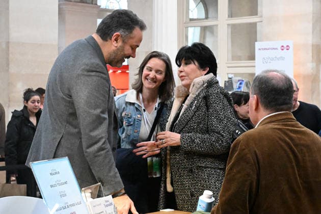 Les Grandes Rencontres Hachette Book Fair - Paris Bruce Toussaint, Liane Foly during the book fair Les Grandes Rencontres Hachette organized by Hachette Livre at the Palais Brongniart to mark its 200th anniversary, in Paris, France on March 14, 2026. Photo by Lionel Urman ABACAPRESS.COM Paris France  Copyright: xUrmanxLionel ABACAx