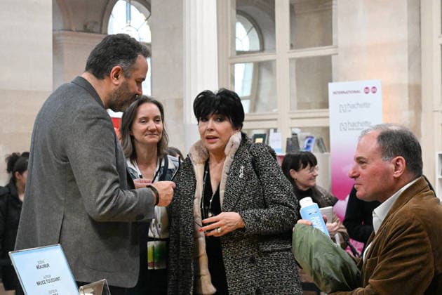 Les Grandes Rencontres Hachette Book Fair - Paris Bruce Toussaint, Liane Foly during the book fair Les Grandes Rencontres Hachette organized by Hachette Livre at the Palais Brongniart to mark its 200th anniversary, in Paris, France on March 14, 2026. Photo by Lionel Urman ABACAPRESS.COM Paris France  Copyright: xUrmanxLionel ABACAx