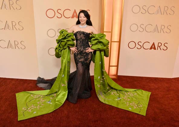 Arden Cho arrives on the red carpet for the 98th annual Academy Awards in the Hollywood section of Los Angeles on Sunday, March 15, 2026. Conan O Brien will host the Oscars for the second consecutive year.  LAP20260315128 JIMxRUYMEN