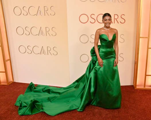 Charithra Chandran arrives on the red carpet for the 98th annual Academy Awards in the Hollywood section of Los Angeles on Sunday, March 15, 2026. Conan O Brien will host the Oscars for the second consecutive year.  LAP20260315137 JIMxRUYMEN
