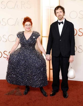 Malgosia Turzanska and Joe Anderson arrive on the red carpet for the 98th annual Academy Awards in the Hollywood section of Los Angeles on Sunday, March 15, 2026. Conan O Brien will host the Oscars for the second consecutive year.  LAP20260315410 JOHNxANGELILLO