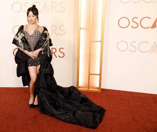 Rei Ami arrives on the red carpet for the 98th annual Academy Awards in the Hollywood section of Los Angeles on Sunday, March 15, 2026. Conan O Brien will host the Oscars for the second consecutive year.  LAP20260315507 JOHNxANGELILLO