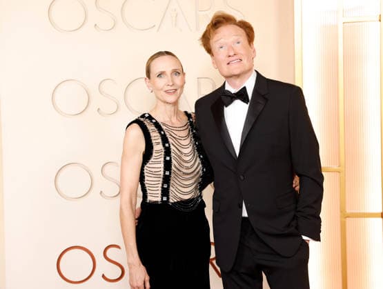(L-R) Liza Powel O Brien and Conan O Brien arrive on the red carpet for the 98th annual Academy Awards in the Hollywood section of Los Angeles on Sunday, March 15, 2026. Conan O Brien will host the Oscars for the second consecutive year.  LAP20260315519 JOHNxANGELILLO