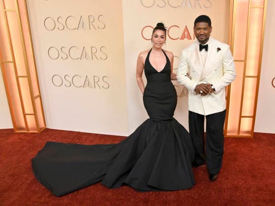 Jennifer Goicoechea and Usher arrive on the red carpet for the 98th annual Academy Awards in the Hollywood section of Los Angeles on Sunday, March 15, 2026. Conan O Brien will host the Oscars for the second consecutive year.  LAP20260315216 JIMxRUYMEN