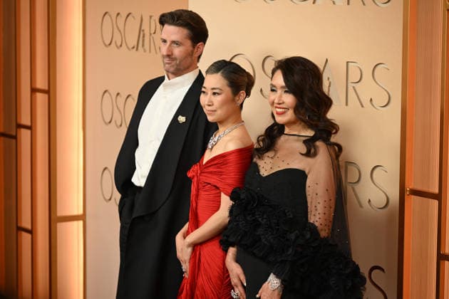 March 15, 2026, Los Angeles, California, USA: CHRIS APPELHANS, MAGGIE KANG AND MICHELLE L.M. WONG during red carpet arrivals for the 98th Academy Awards, presented by the Academy of Motion Picture Arts and Sciences (AMPAS), at the Dolby Theatre in Hollywood. Los Angeles USA  - ZUMAz03_ 20260315_abp_z03_079 Copyright: xKevinxSullivanx