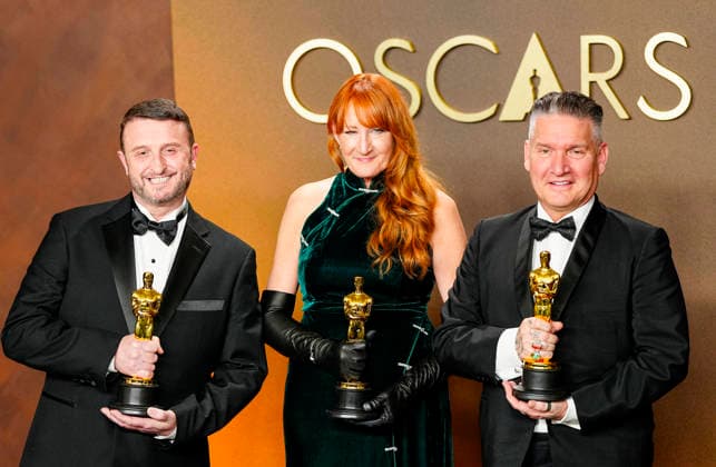Mike Hill, Cliona Furey, and Jordan Samuel celebrate in the press photo room after winning the Makeup and Hairstyling Oscar for Frankenstein during the 98th annual Academy Awards in the Hollywood section of Los Angeles on Sunday, March 15, 2026. Conan O Brien is hosting the Oscars for the second consecutive year.  LAP20260315336 BONNIExCASH
