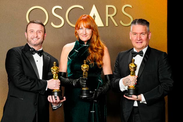 Mike Hill, Cliona Furey, and Jordan Samuel celebrate in the press photo room after winning the Makeup and Hairstyling Oscar for Frankenstein during the 98th annual Academy Awards in the Hollywood section of Los Angeles on Sunday, March 15, 2026. Conan O Brien is hosting the Oscars for the second consecutive year.  LAP20260315338 BONNIExCASH