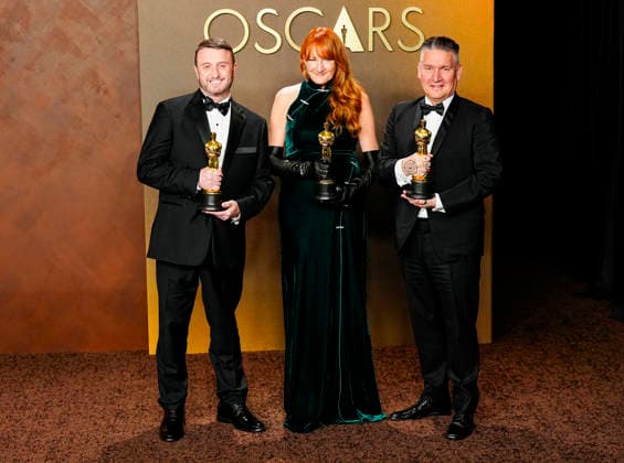 Mike Hill, Cliona Furey, and Jordan Samuel celebrate in the press photo room after winning the Makeup and Hairstyling Oscar for Frankenstein during the 98th annual Academy Awards in the Hollywood section of Los Angeles on Sunday, March 15, 2026. Conan O Brien is hosting the Oscars for the second consecutive year.  LAP20260315339 BONNIExCASH